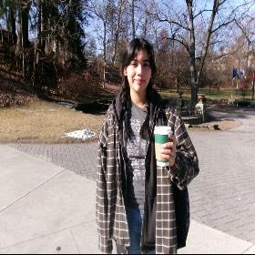 Janel holding a coffee